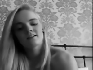 Blonde teen is playing on her webcam and gets naked to masturbate