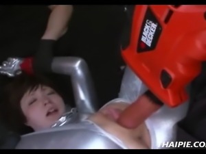 Asian in a bodysuit made to orgasm with power tools