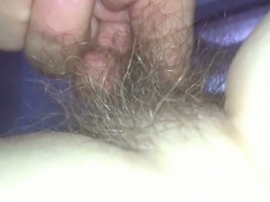 exposing her soft hairy pubic hair.