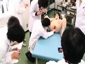 Slim Oriental cutie has a group of doctors examining her ha