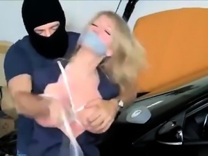 Busty amateur blonde milf gets tied up by a masked stranger