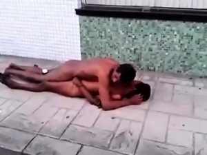 Naked black couple caught having sex on the sidewalk