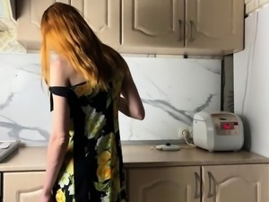 Petite young redhead sucking off a big dick in the kitchen