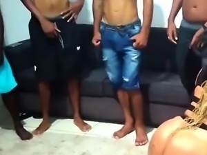 Big butt Brazilian milf works her mouth on a gang of cocks